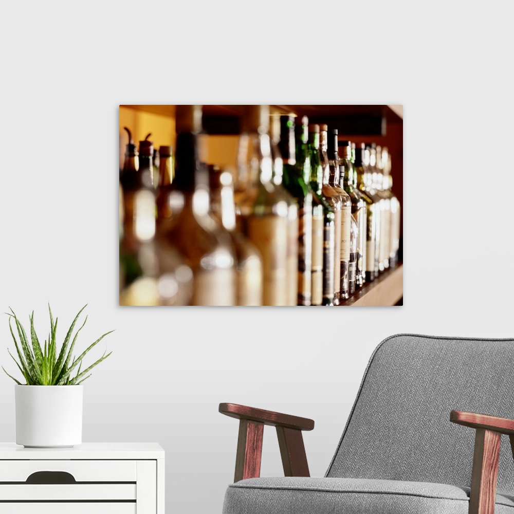 A modern room featuring Shelf of liquor bottles (differential focus