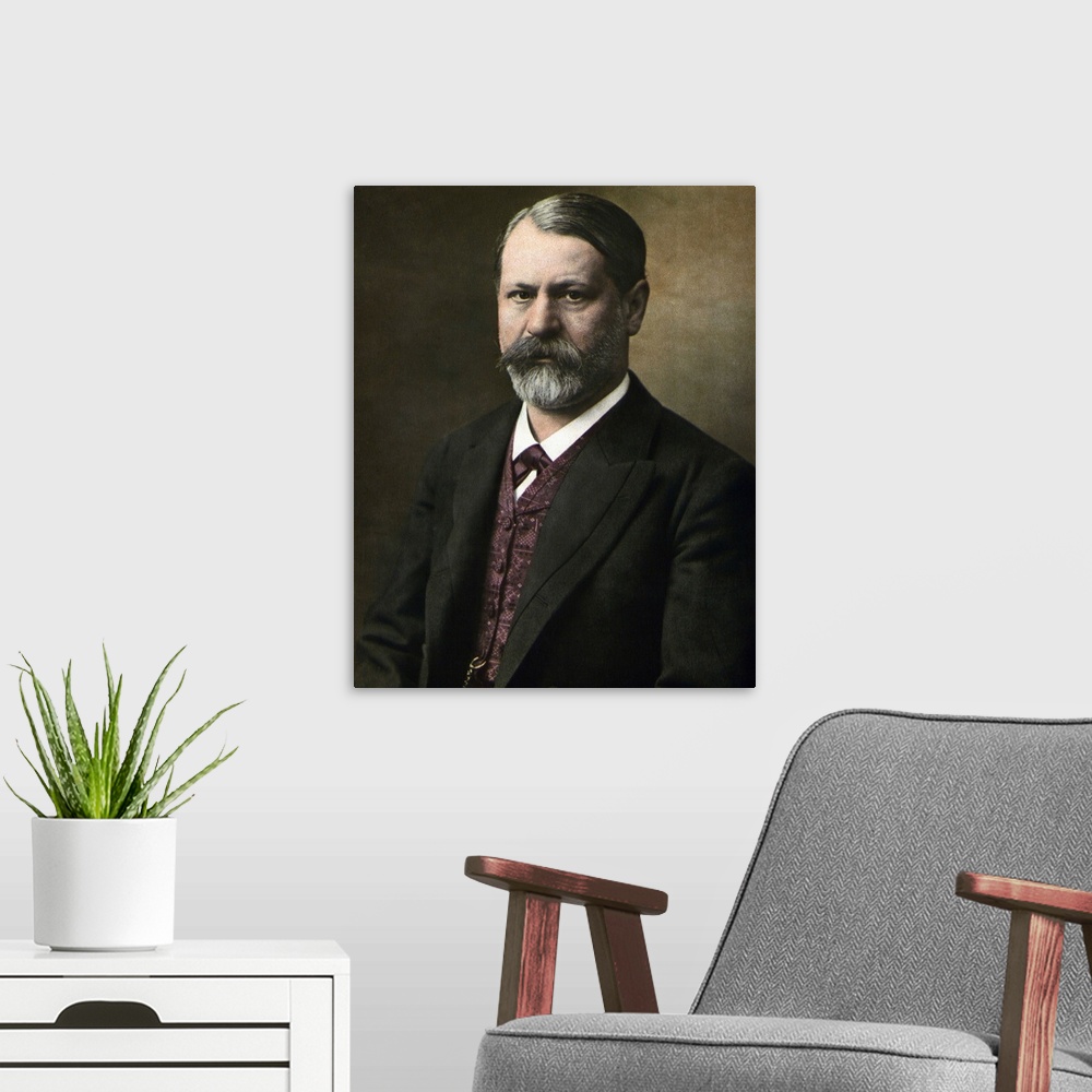 A modern room featuring Sigmund Freud (1856-1939). Half Length photograph taken in his middle years. Undated photograph.