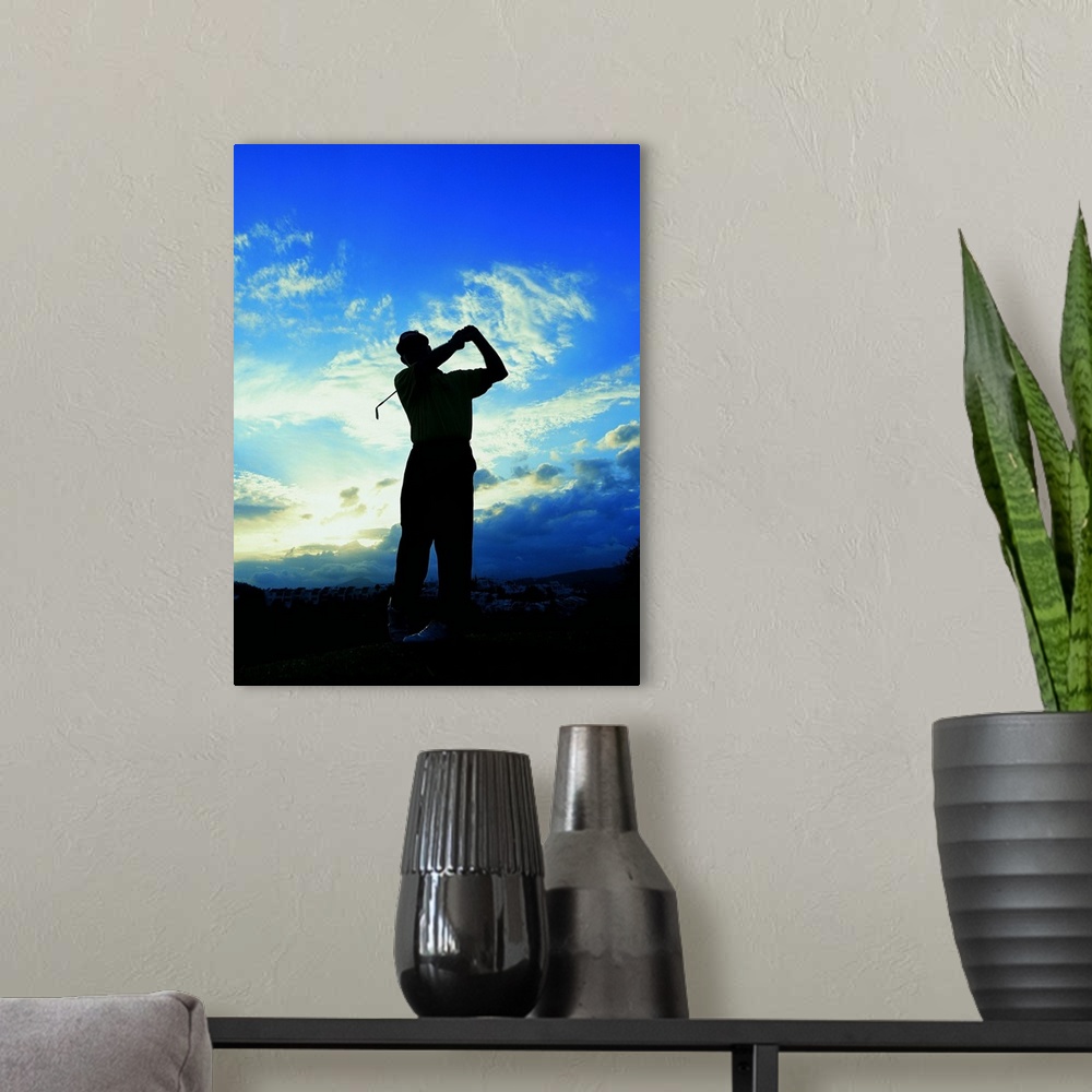 A modern room featuring silhouette of a golfer after a swing