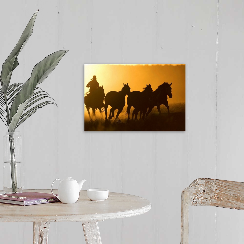 A farmhouse room featuring Silhouette Of Cowboy Herding Horses