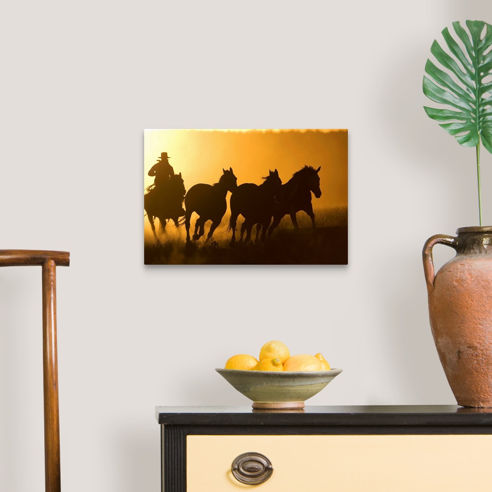 A traditional room featuring Silhouette Of Cowboy Herding Horses
