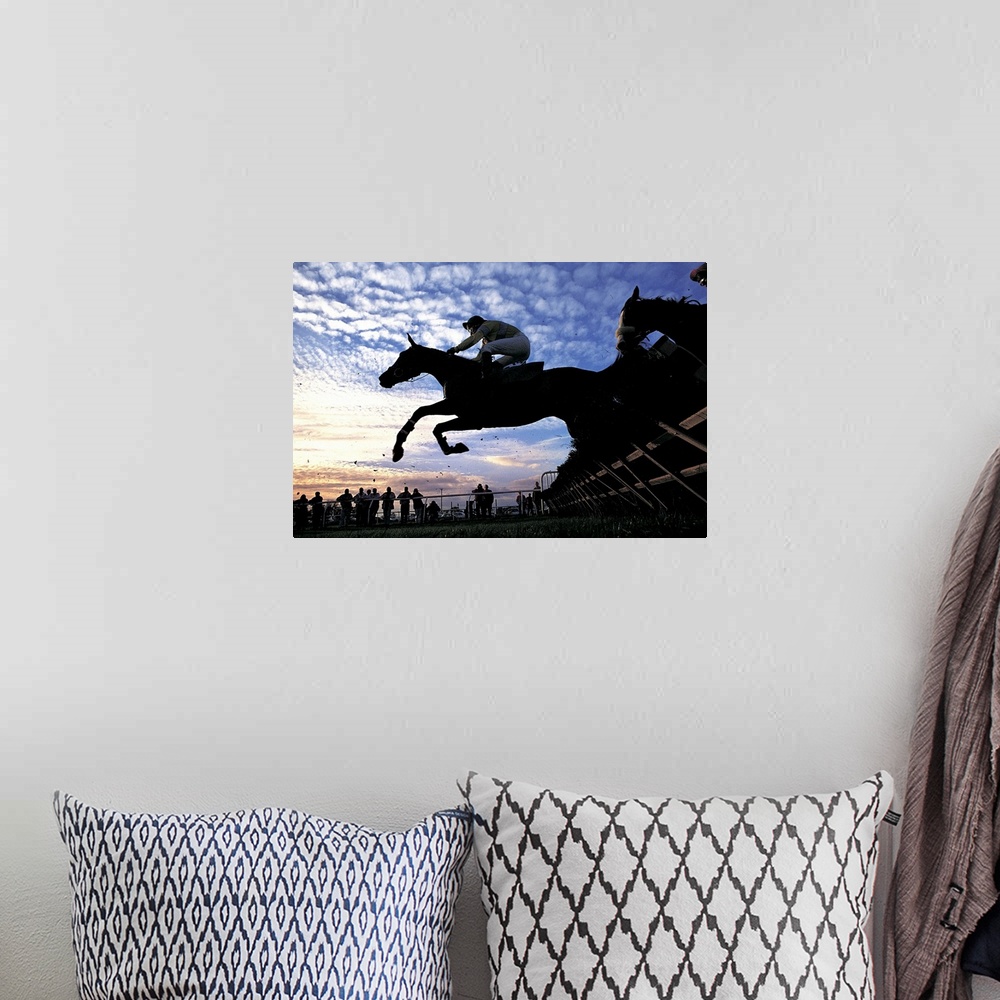 A bohemian room featuring Silhouette of Horses Jumping a Steeplechase