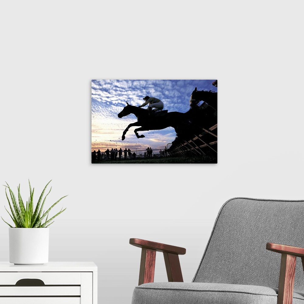 A modern room featuring Silhouette of Horses Jumping a Steeplechase