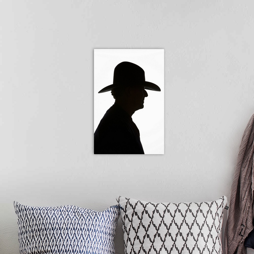 A bohemian room featuring Silhouette Of Man In Profile Wearing Traditional Cowboy Hat With High Crown.