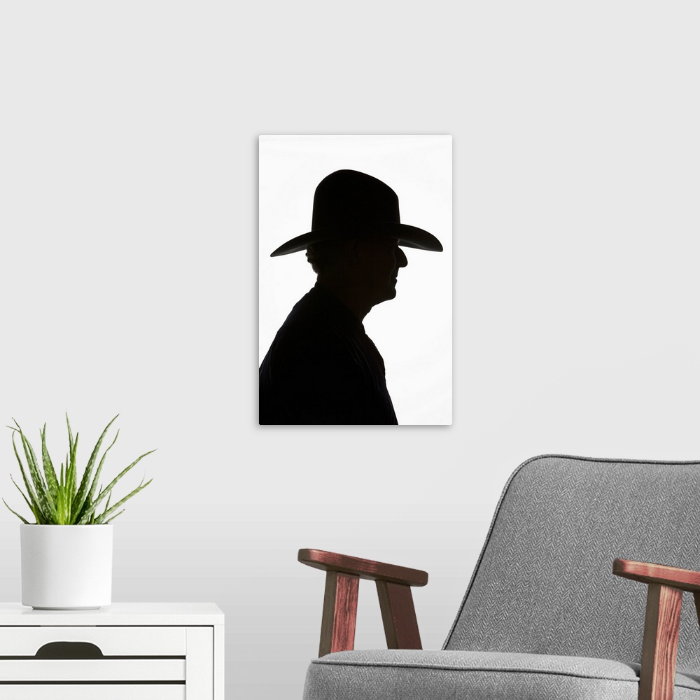 A modern room featuring Silhouette Of Man In Profile Wearing Traditional Cowboy Hat With High Crown.