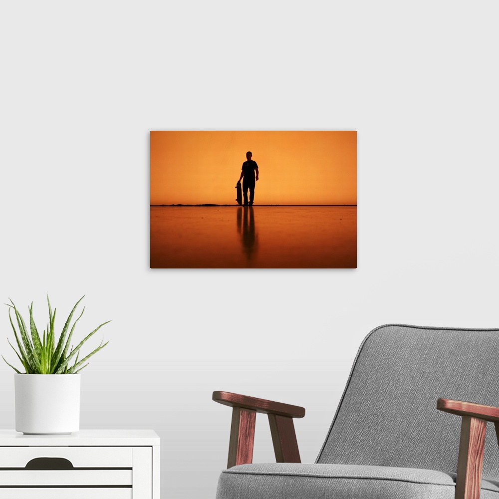 A modern room featuring Silhouette of man with skateboard, Berlin.