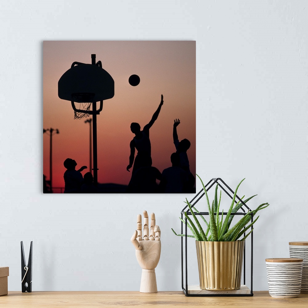 A bohemian room featuring Silhouette of men playing basketball