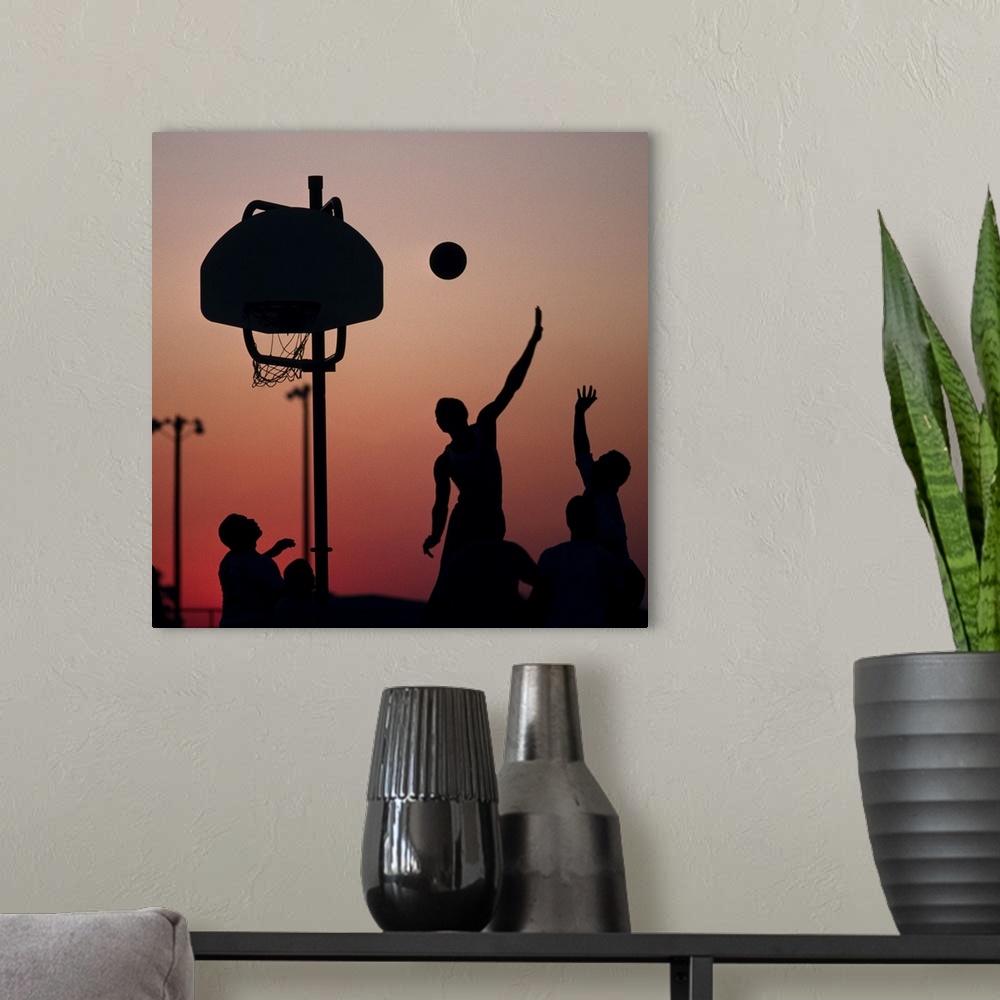 A modern room featuring Silhouette of men playing basketball