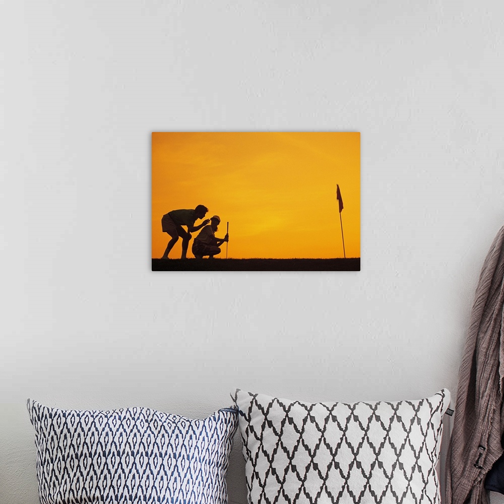 A bohemian room featuring Silhouette of people playing golf