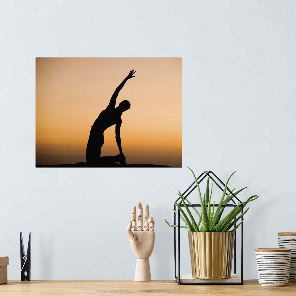 A bohemian room featuring Silhouette of person stretching