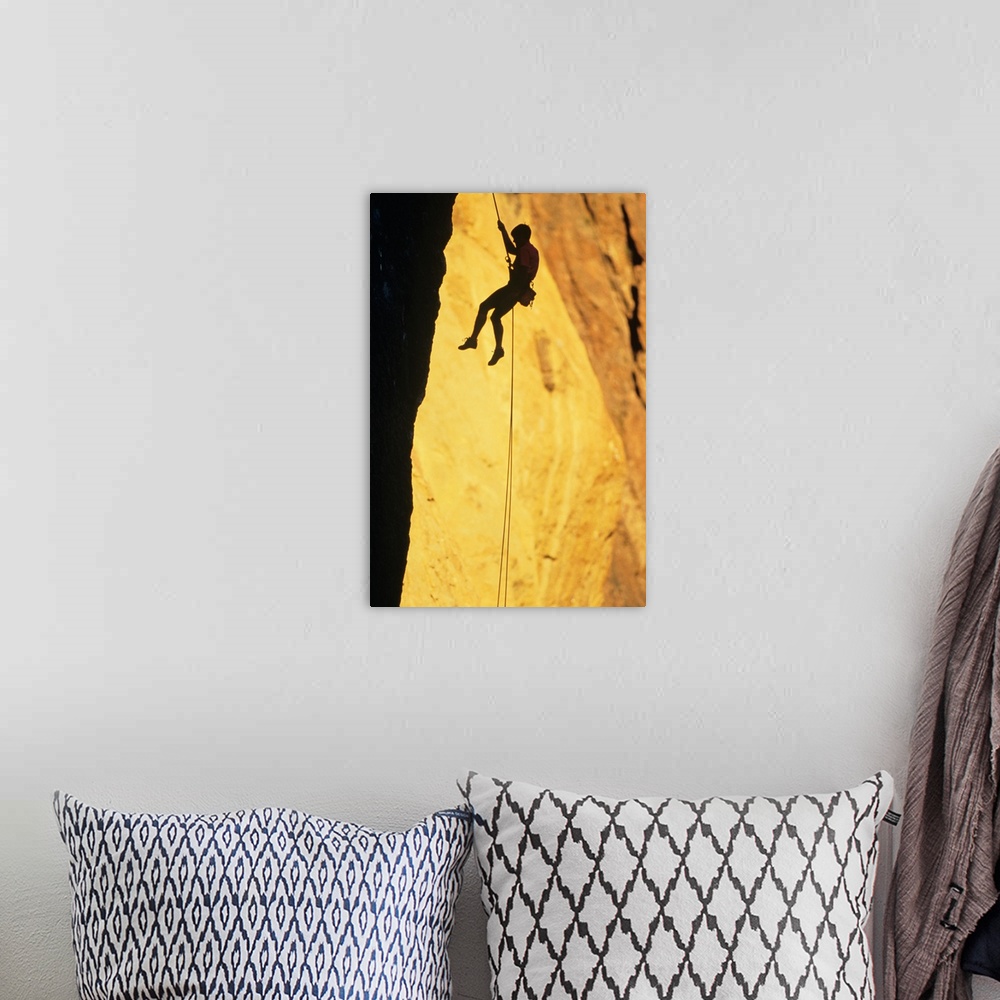 A bohemian room featuring Silhouette of rock climber on Smith Rock, Oregon, USA