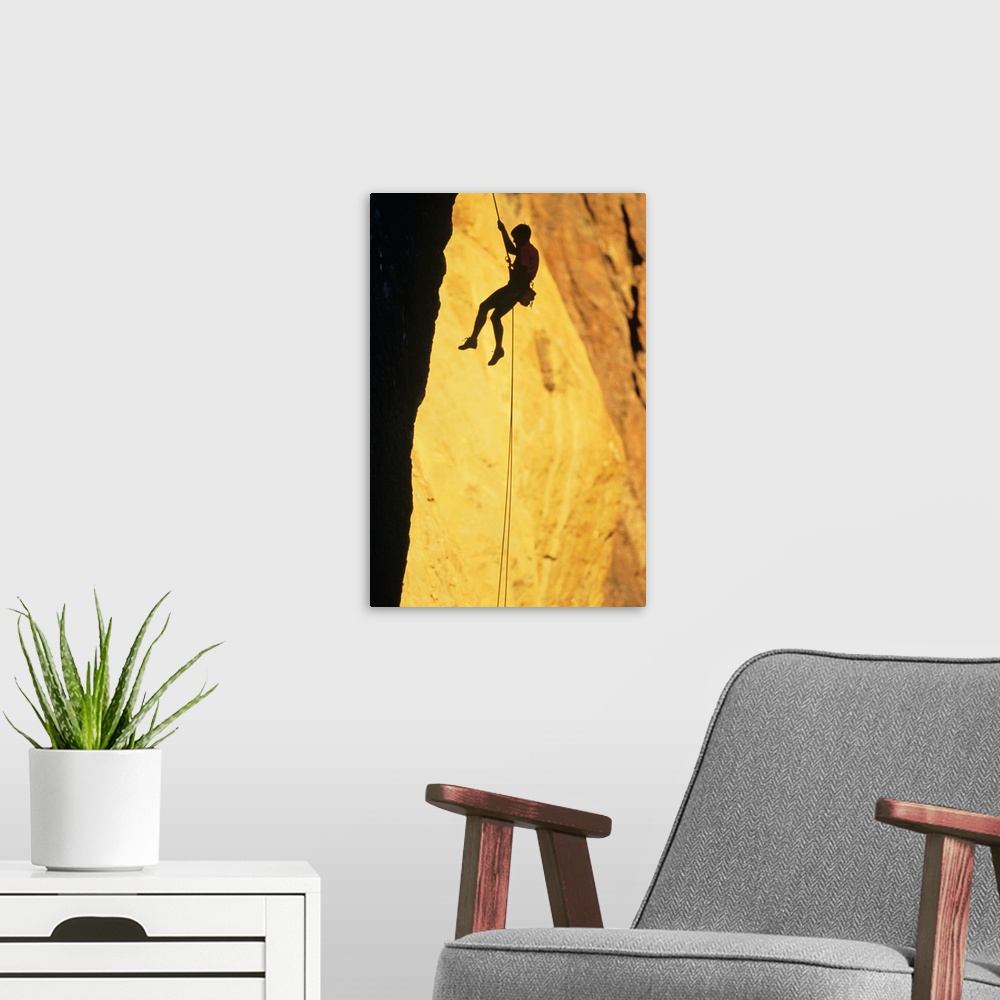 A modern room featuring Silhouette of rock climber on Smith Rock, Oregon, USA