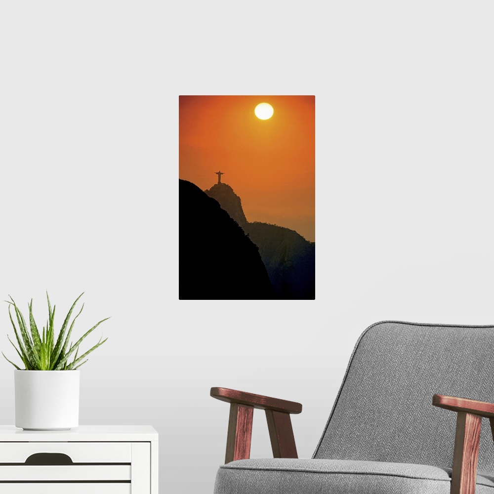 A modern room featuring Silhouette of statue of Jesus Christ at sunset, Rio de Janeiro, Brazil