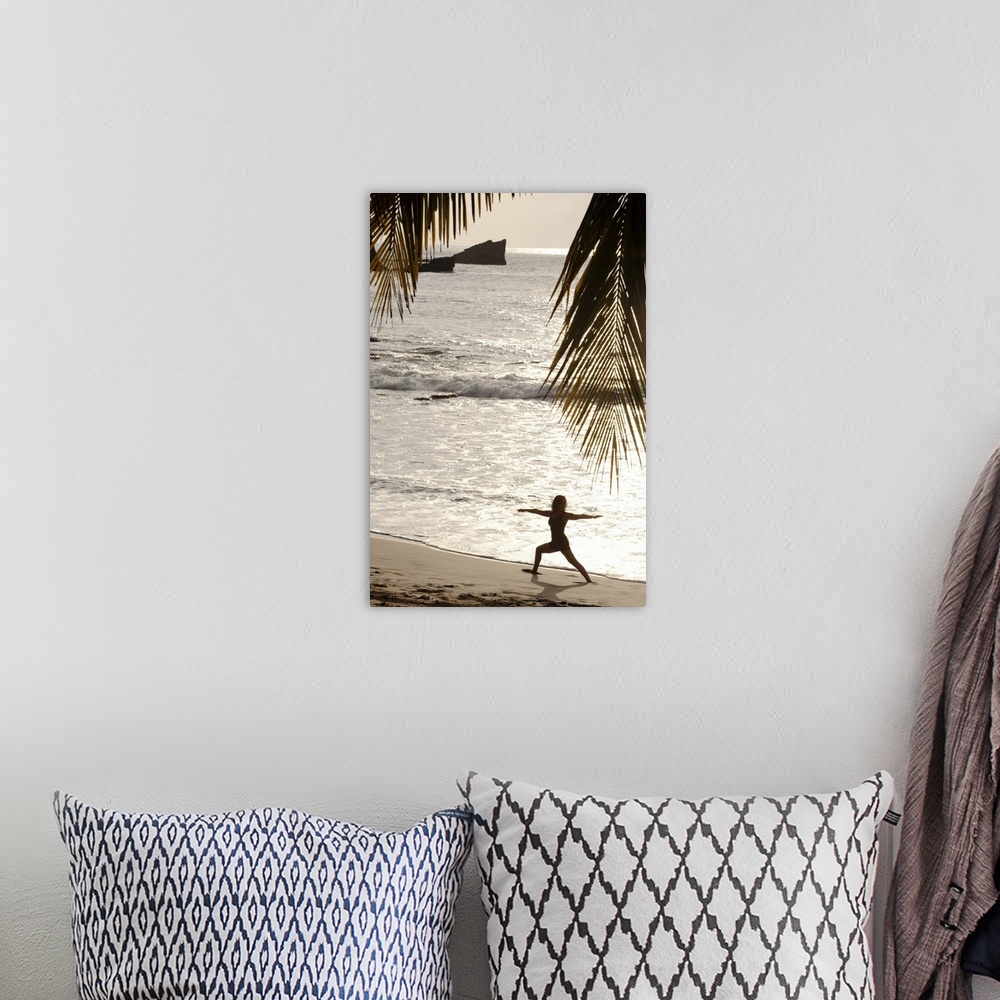 A bohemian room featuring Silhouette of woman doing yoga on beach