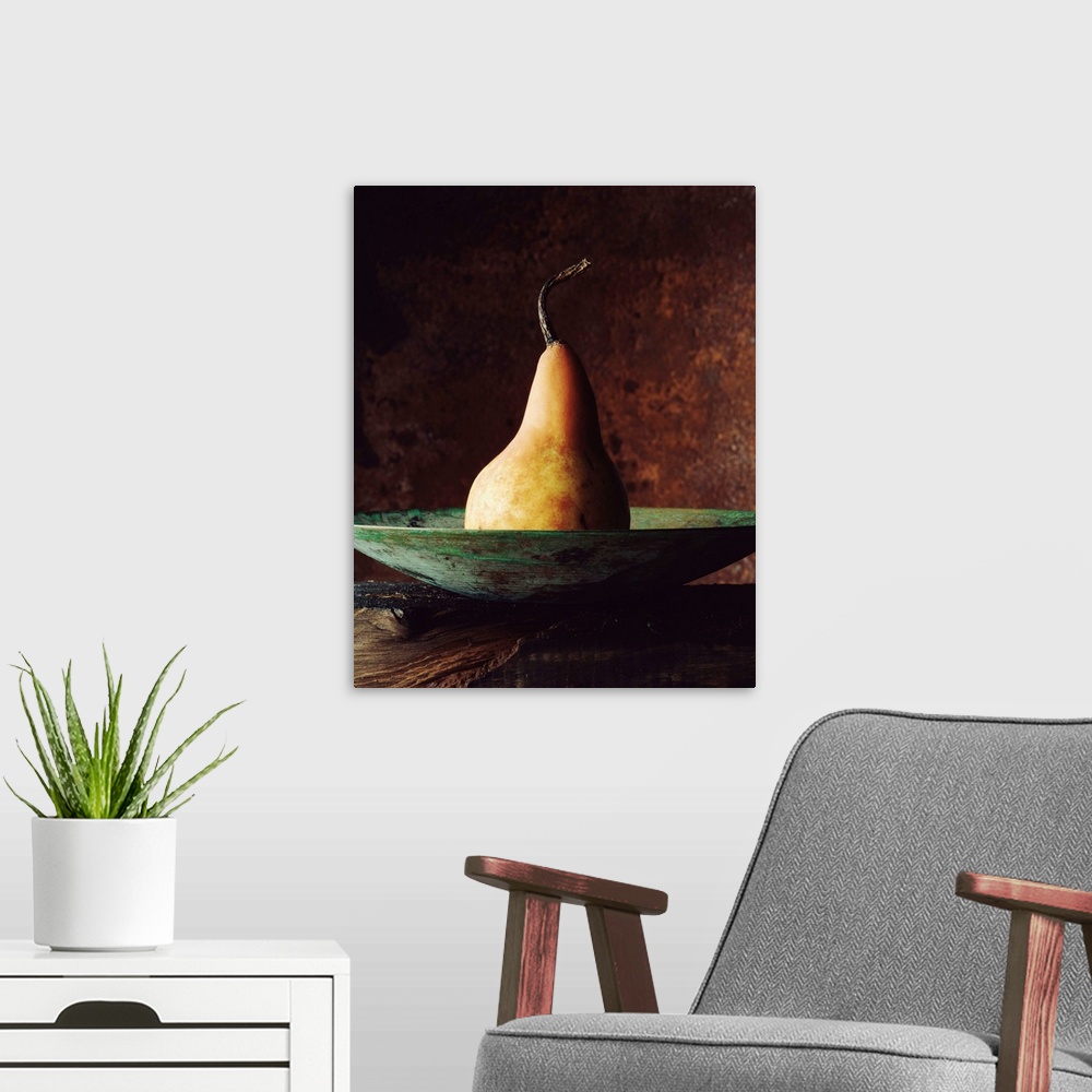 A modern room featuring Single Pear In Bowl
