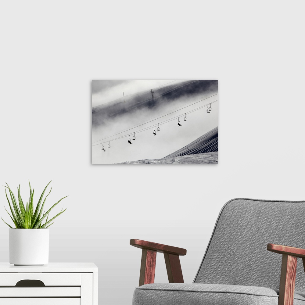 A modern room featuring Skiers on a chair lift