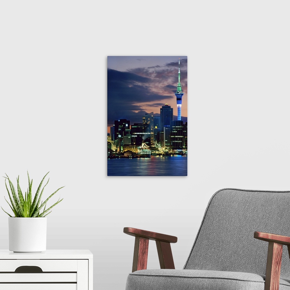 A modern room featuring Sky Tower and cruise ships in Auckland Harbour, North Island, New Zealand