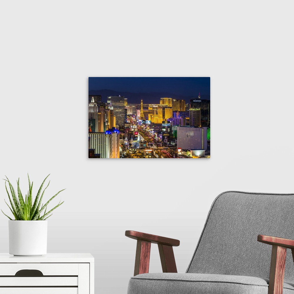 A modern room featuring Las Vegas skyline, showing Las Vegas Strip at twilight, Las Vegas, Nevada, USA. Most of the large...