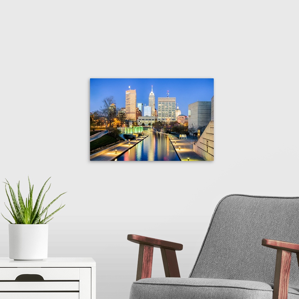 A modern room featuring Downtown Indianapolis reflecting on the canal.
