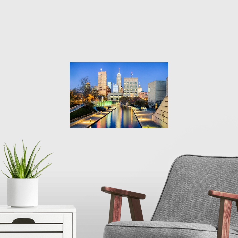 A modern room featuring Downtown Indianapolis reflecting on the canal.