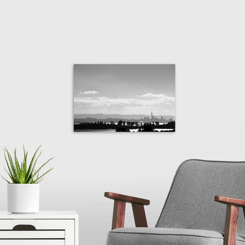 A modern room featuring Black and white skyline of Auckland, New Zealand as seen from Waiheke Island, New Zealand.