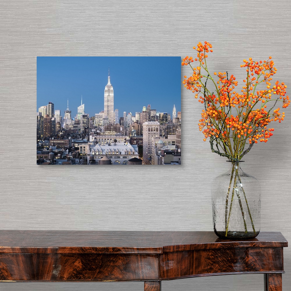 A traditional room featuring Skyline of Midtown Manhattan with Empire State Building at dusk