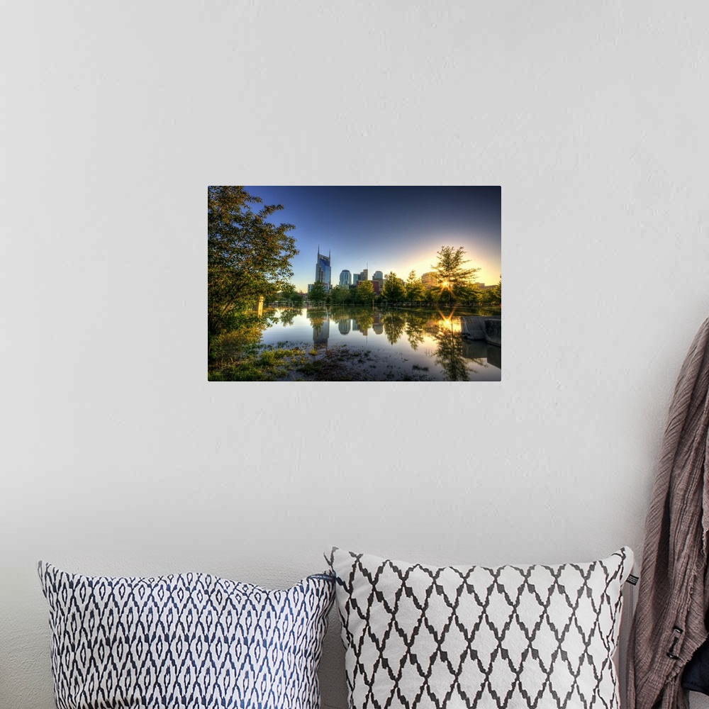 A bohemian room featuring Skyline of Nashville reflection in water at sunset.