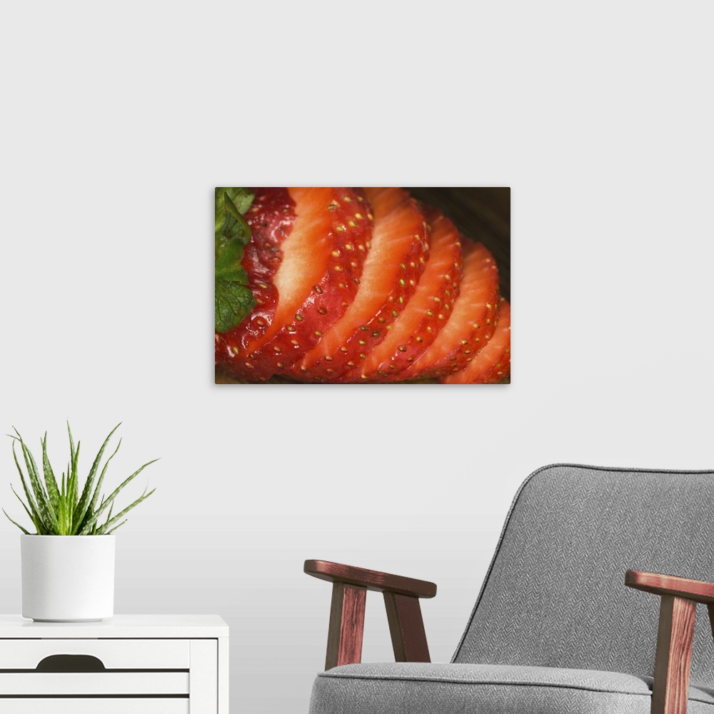 A modern room featuring Sliced strawberry on wood cutting-board