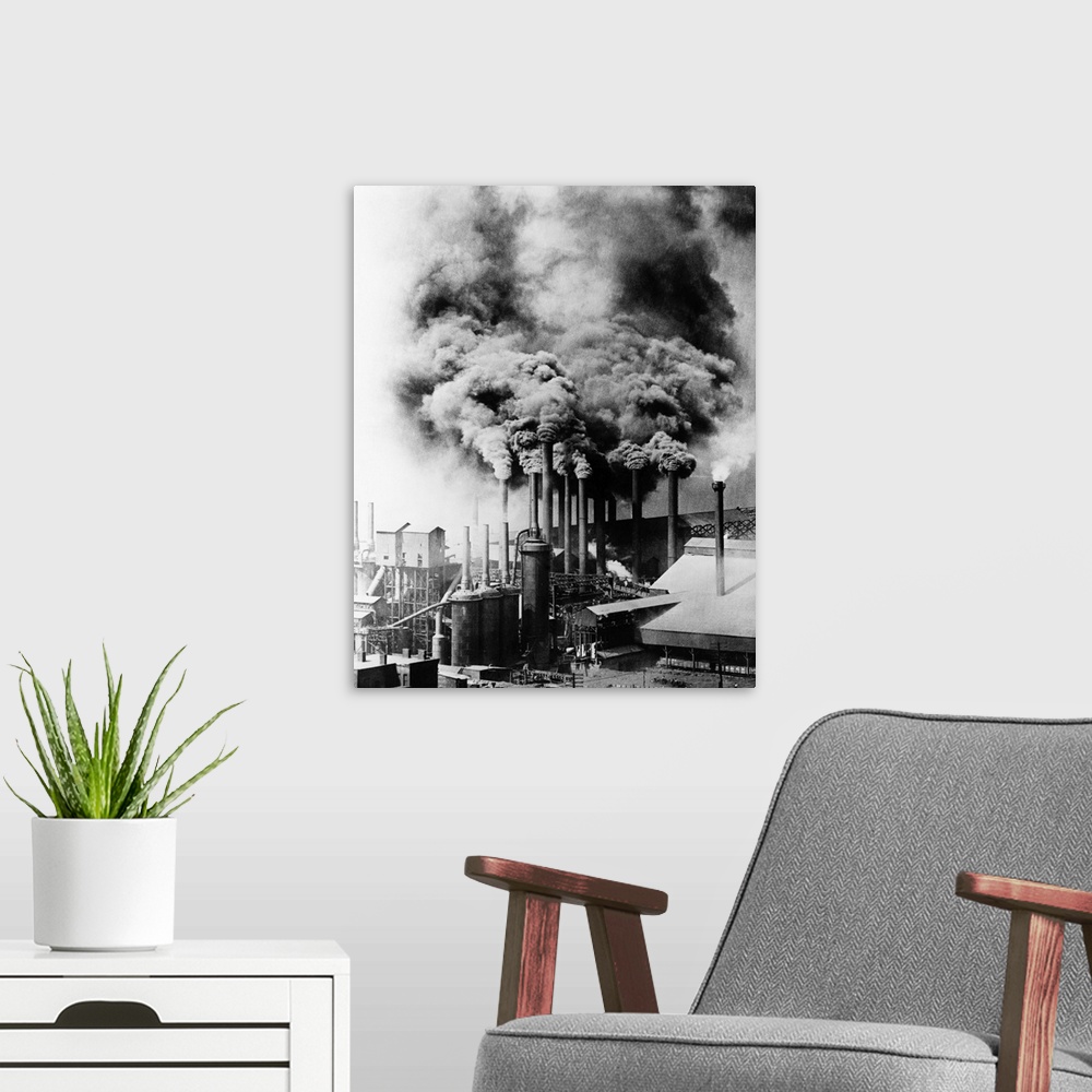 A modern room featuring Smokestacks from factory in Pittsburgh, Pennsylvania, belch black smoke into the atmosphere, 1890s.