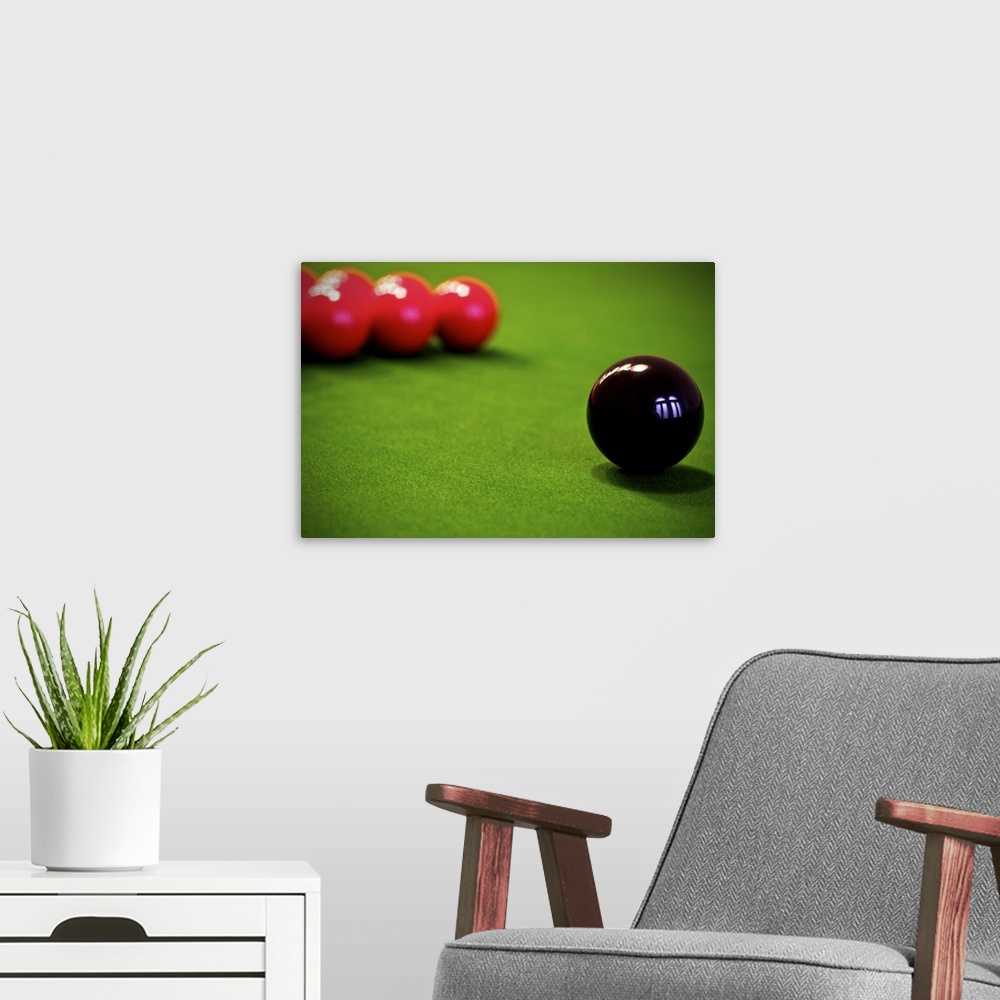 A modern room featuring Snooker, 'chess with balls', billiards.