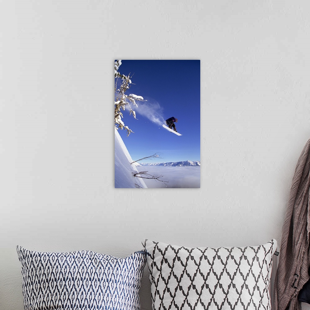 A bohemian room featuring Snowboarder in mid-air