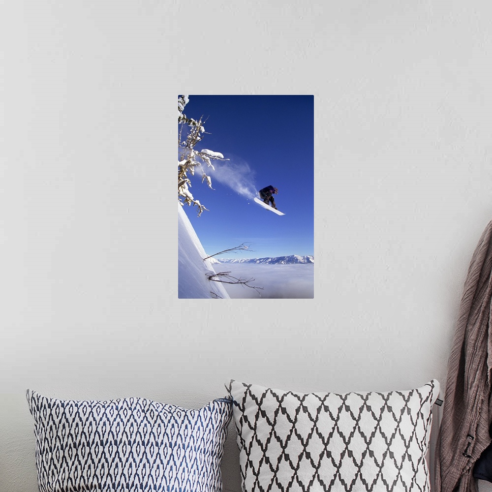 A bohemian room featuring Snowboarder in mid-air