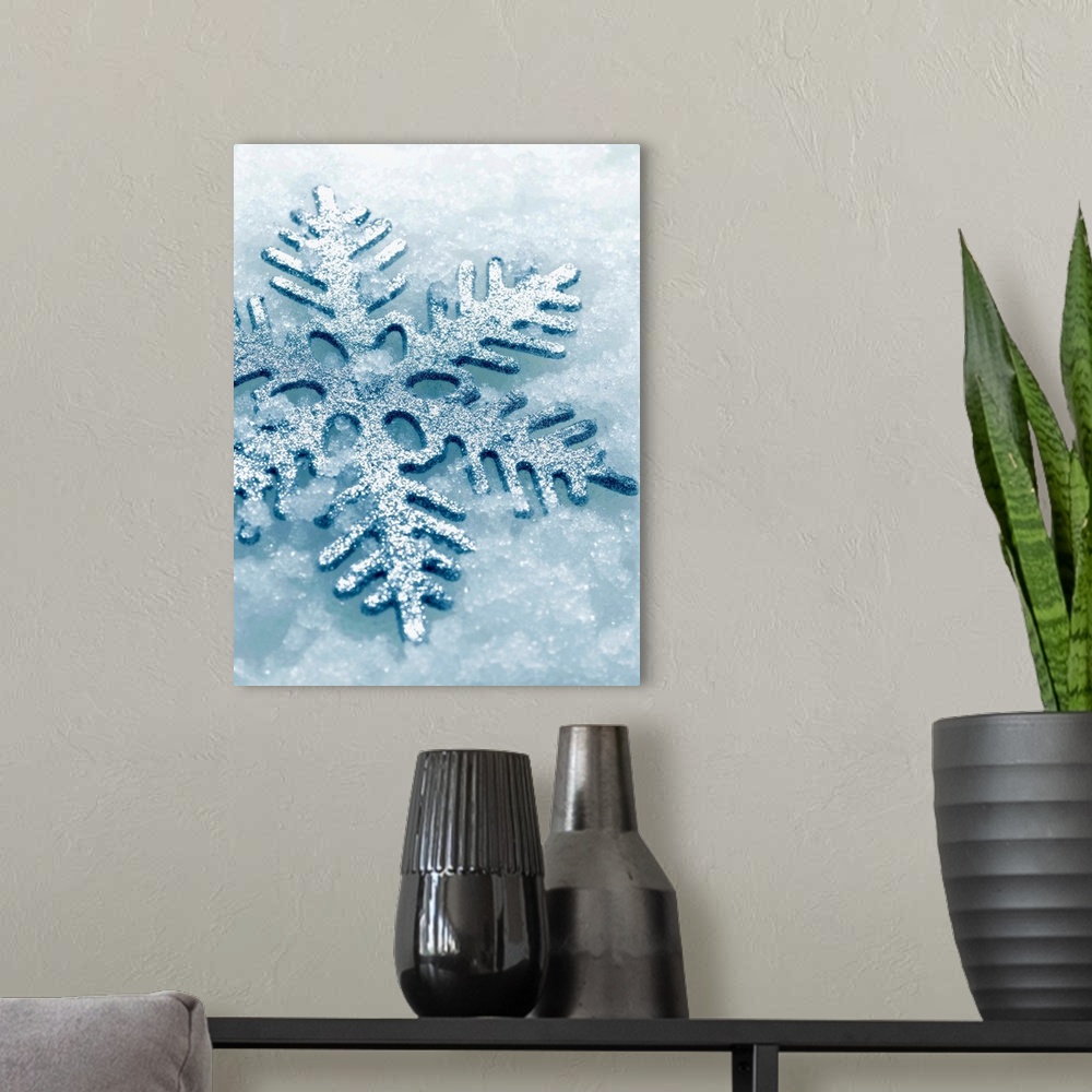 A modern room featuring Snowflake Shaped Christmas Ornament Lying In The Snow