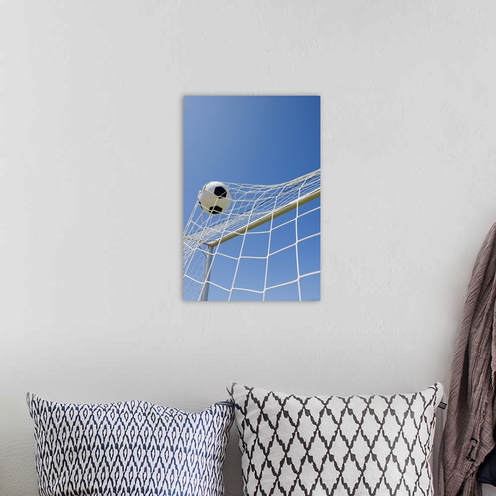 A bohemian room featuring Soccer ball and goal