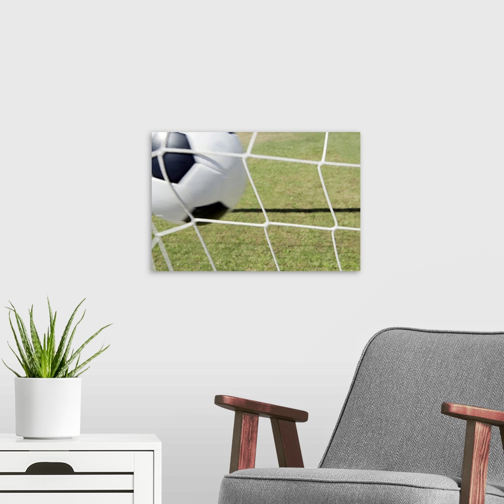 A modern room featuring Soccer ball and goal