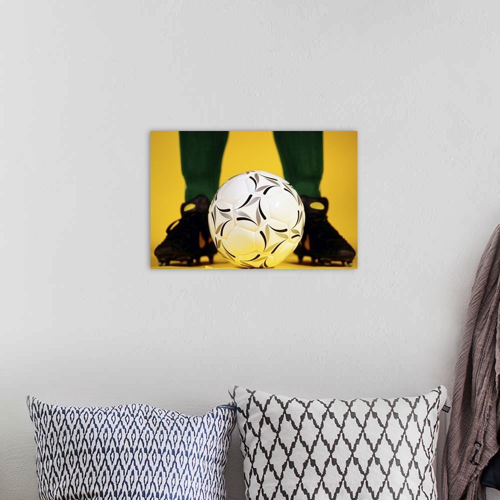 A bohemian room featuring Soccer ball at feet