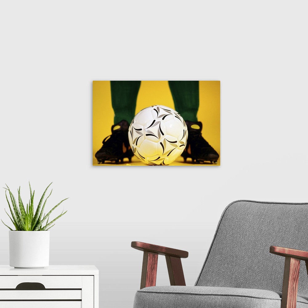 A modern room featuring Soccer ball at feet
