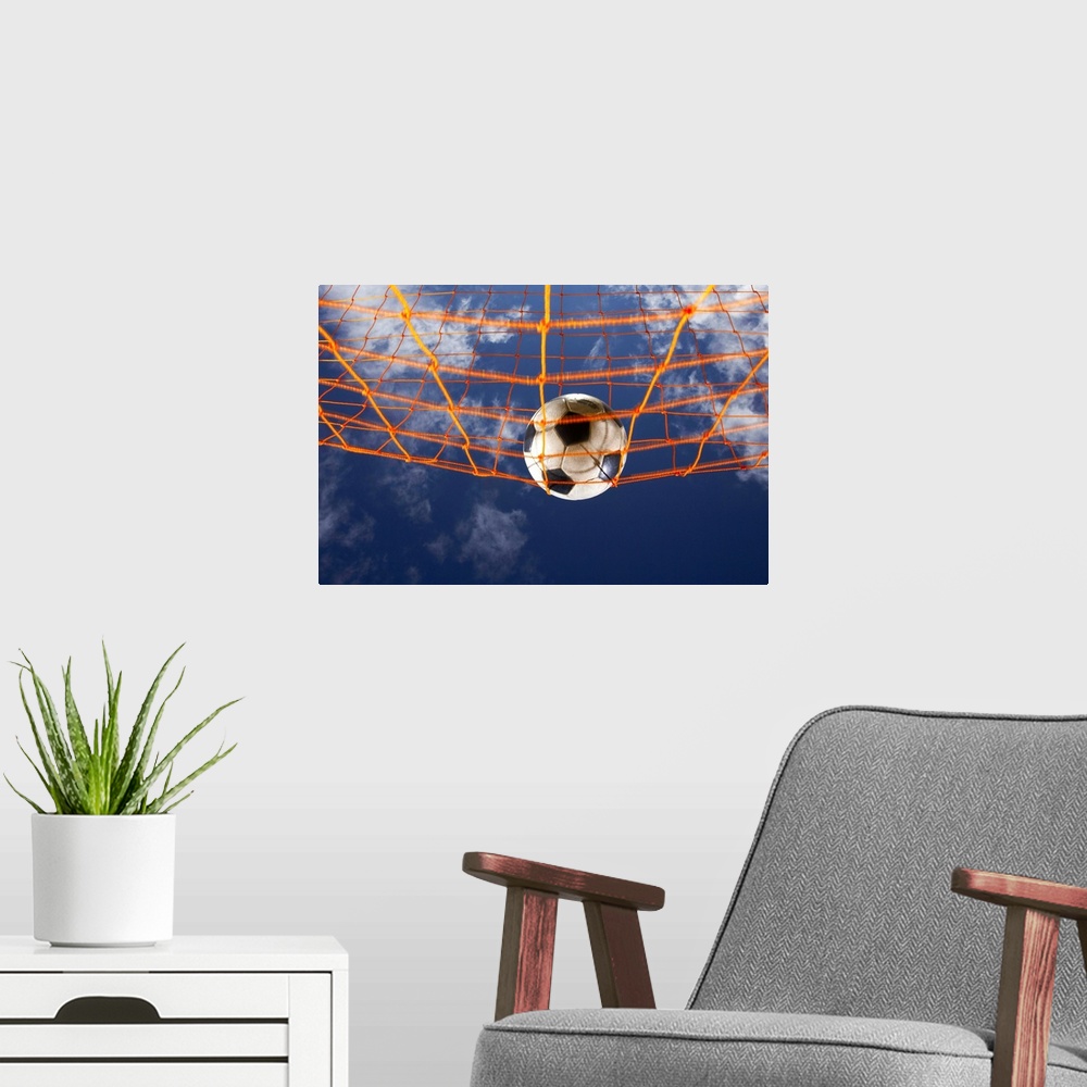 A modern room featuring Soccer Ball Going Into Goal Net