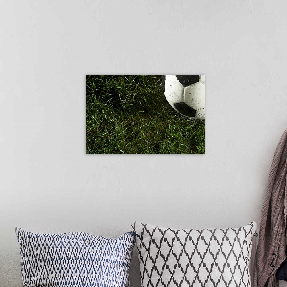 A bohemian room featuring Soccer ball in grass