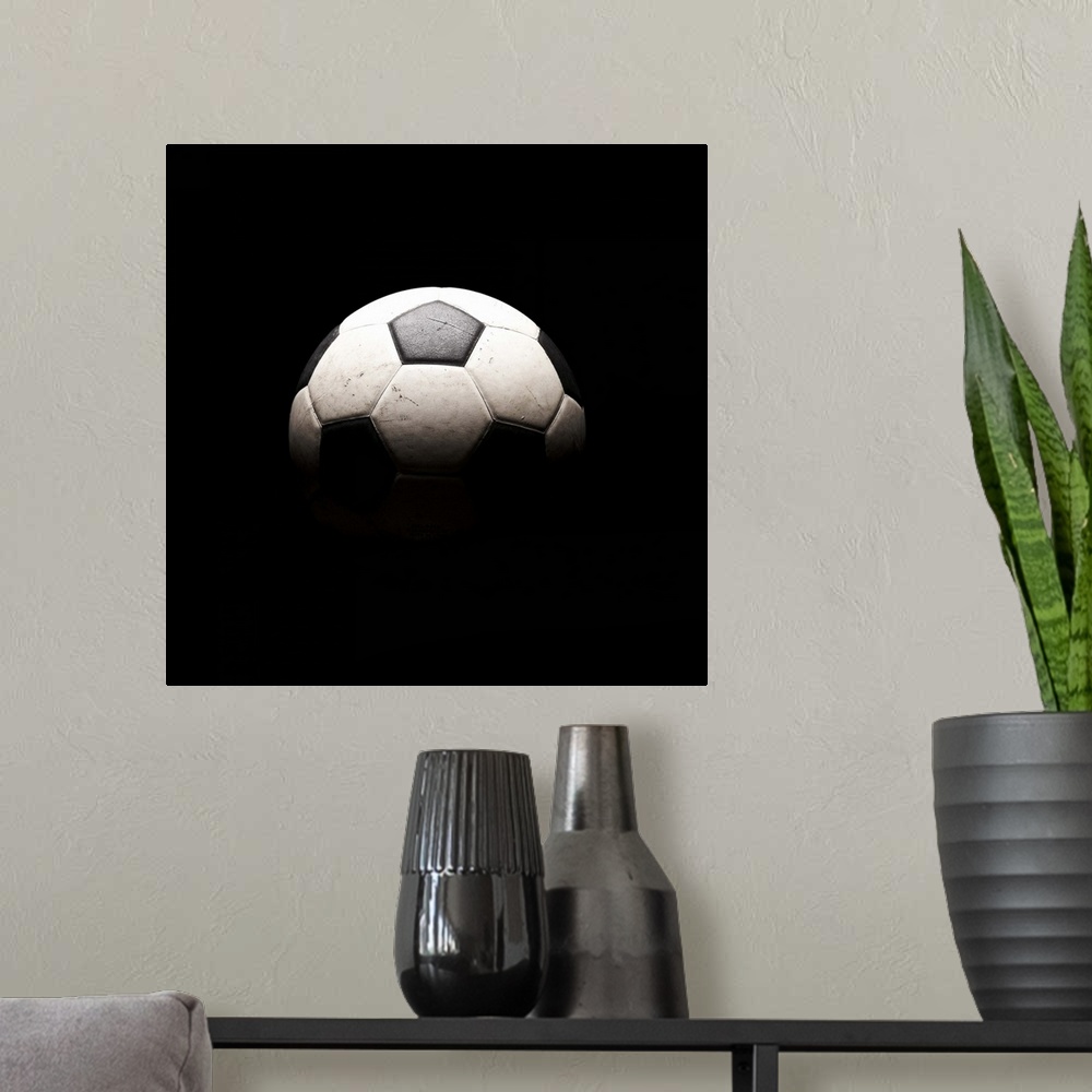 A modern room featuring Soccer ball in shadows