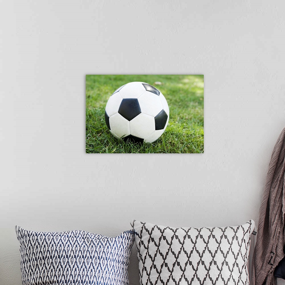 A bohemian room featuring Soccer ball on grass
