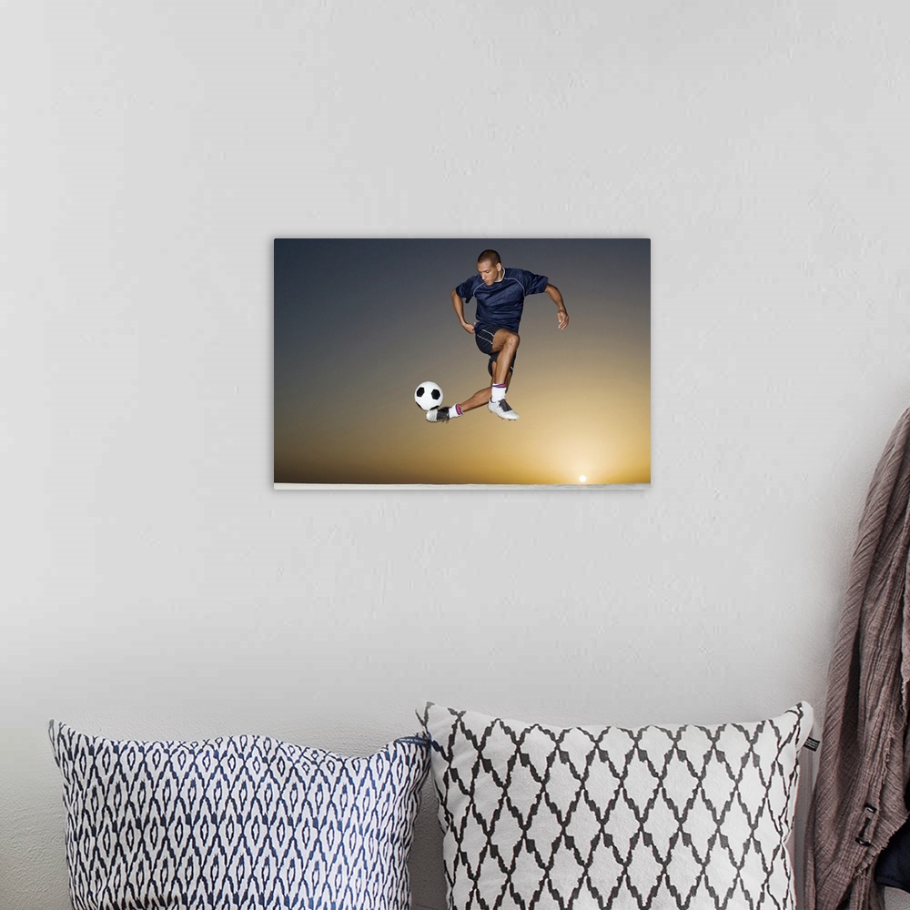 A bohemian room featuring This athletic wall art for a childos room or office shows a man in the air contorting his body to...