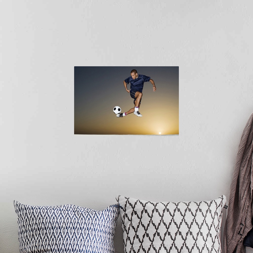 A bohemian room featuring This athletic wall art for a childos room or office shows a man in the air contorting his body to...