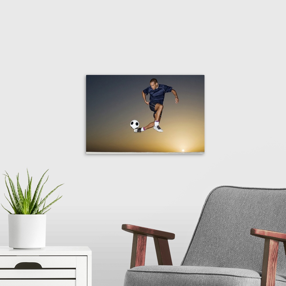 A modern room featuring This athletic wall art for a childos room or office shows a man in the air contorting his body to...