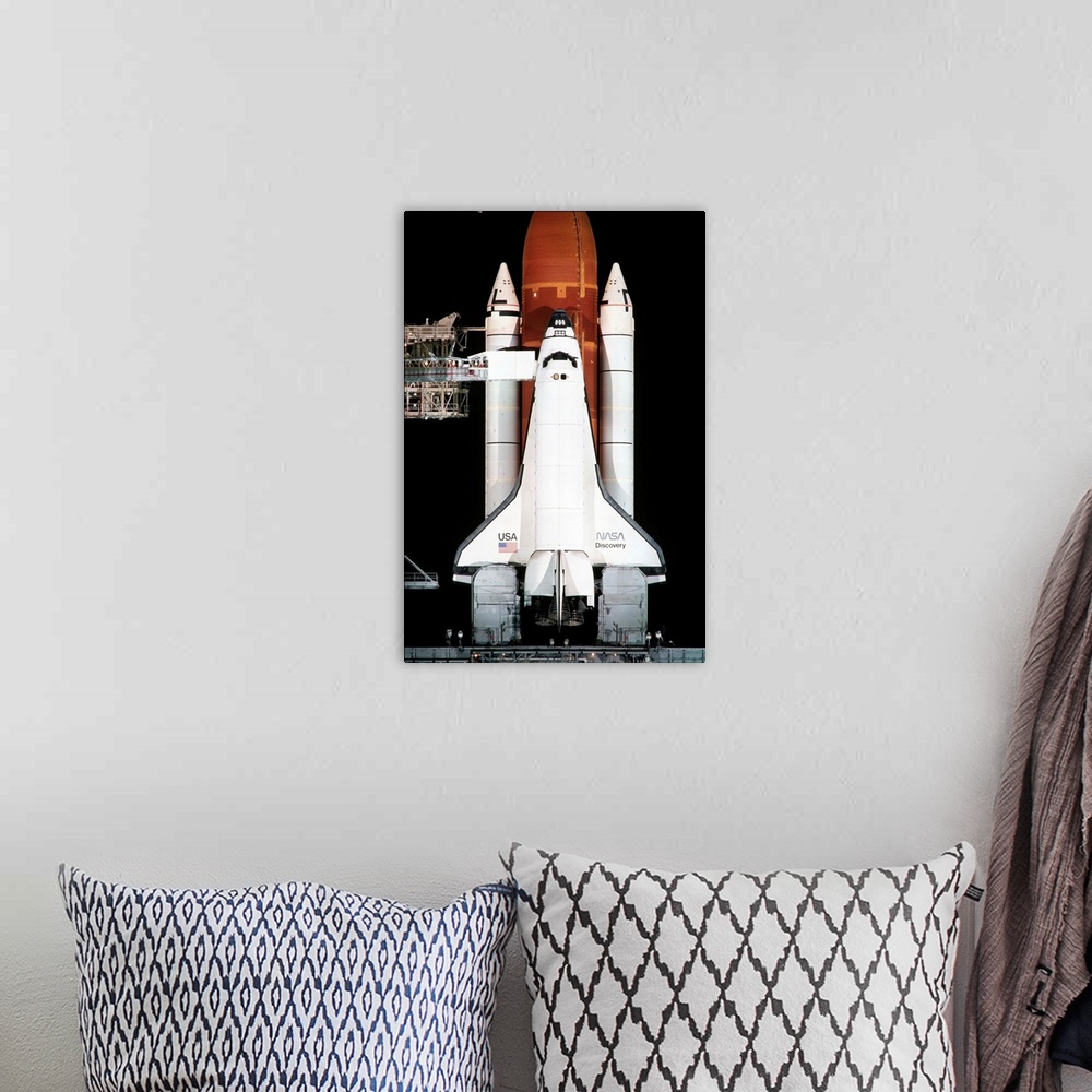 A bohemian room featuring The space shuttle Discovery sits on the launch pad on the eve of the launch of Space Shuttle Miss...