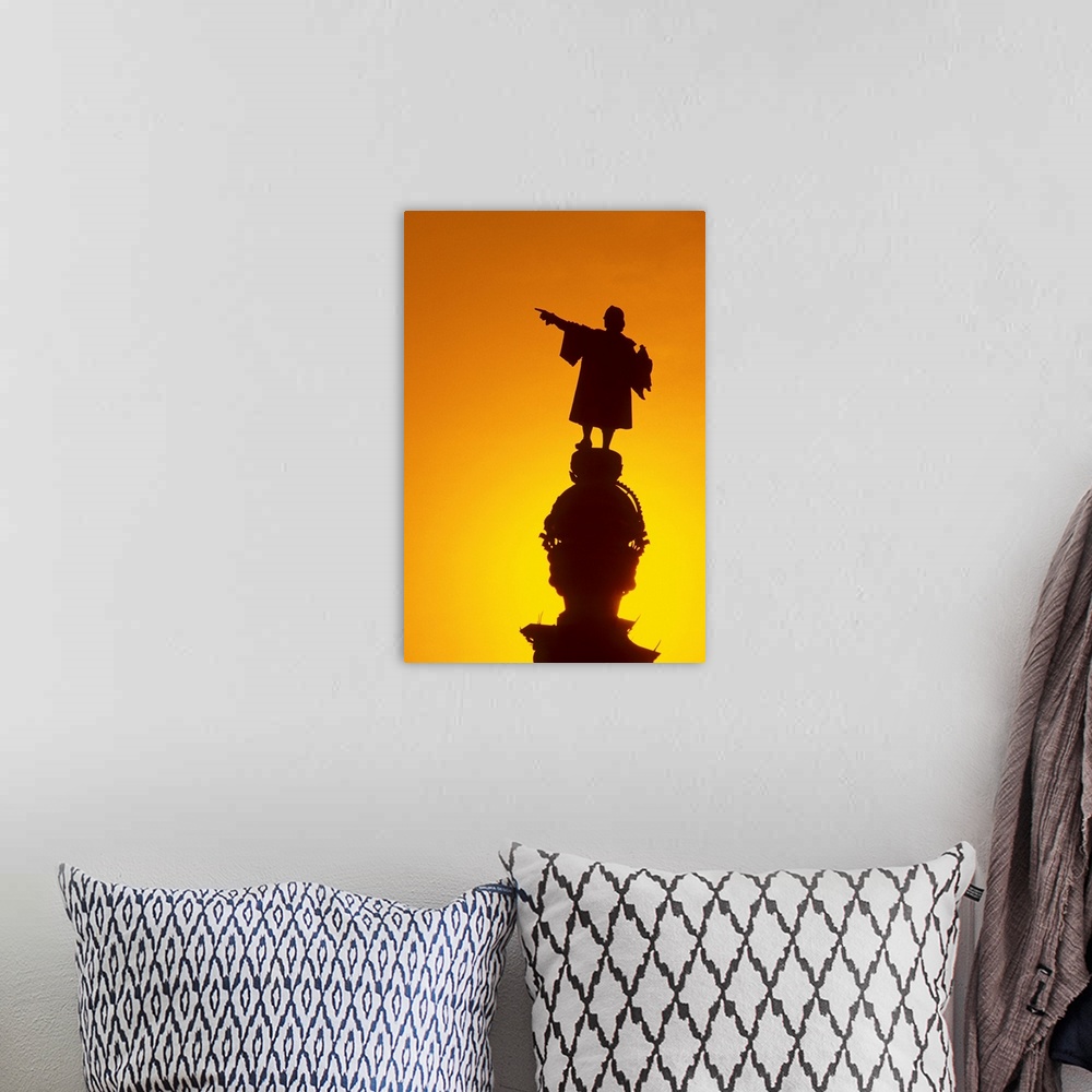 A bohemian room featuring Spain, Barcelona, silhouette of Columbus monument, sunset