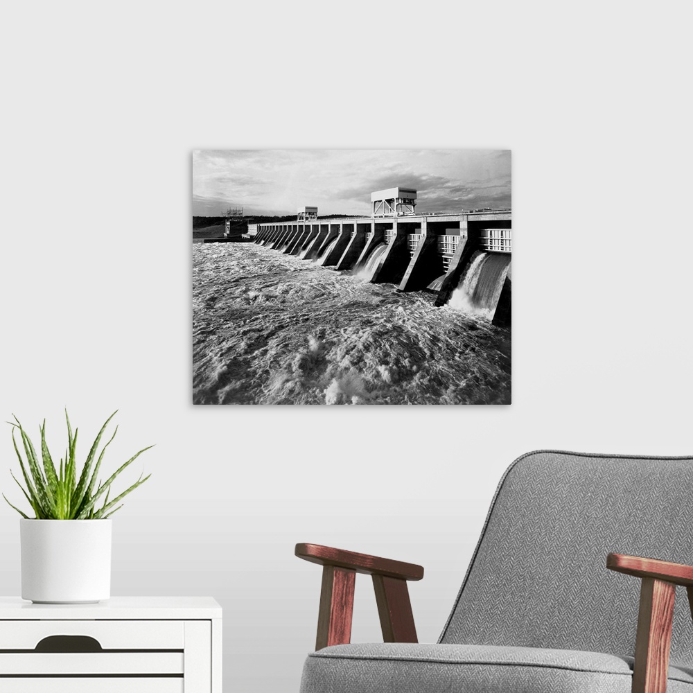 A modern room featuring Water pours from open spillways at the Pickwick Landing Dam, a project of the Tennessee Valley Au...