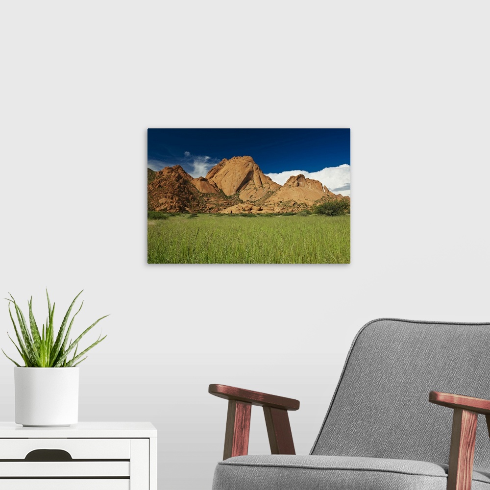 A modern room featuring Spitzkoppe or Spitzkuppe, arid mountain landscape of granite rocks, Matterhorn of Namibia, Namibi...