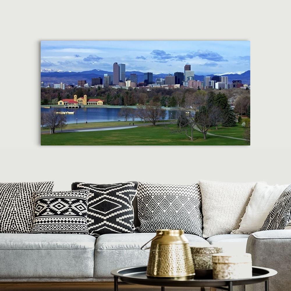 A bohemian room featuring Denver Skyline from City Park with boat house and lake and Mt. Evans in background.