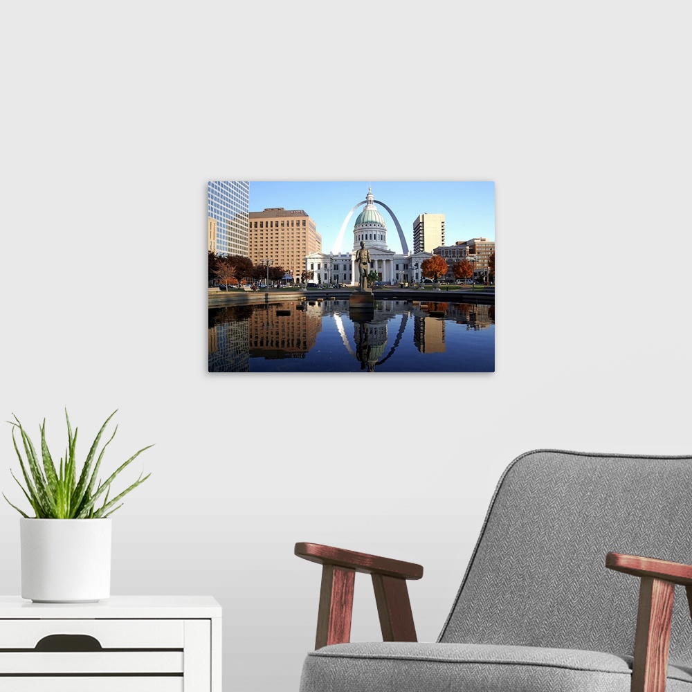 A modern room featuring St Louis Downtown overlooking Gateway Arch in fine afternoon.